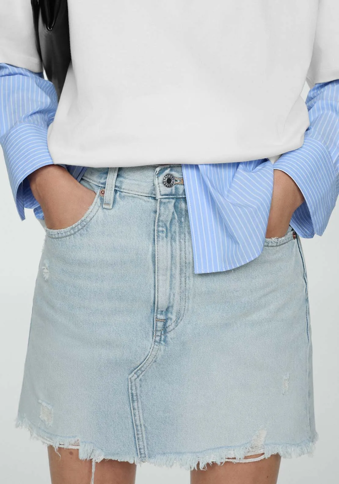 Denim miniskirt with frayed hem