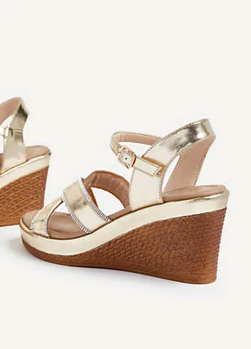 Linzi Joslyn Gold Faux Leather Wedge With Diamante Crossover Front Straps | Grattan